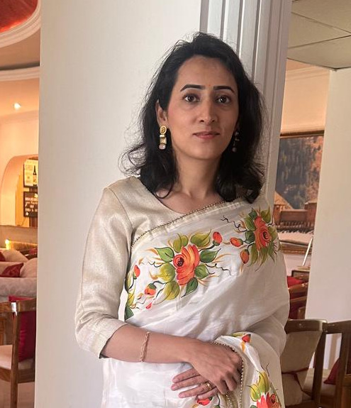 Neha Arora, founder of Arteque Looms & Crafts, wearing a hand-painted saree